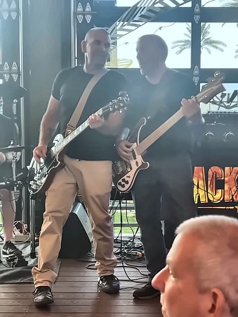 Mike playing bass alongside the guitarist