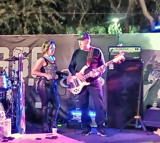 Mike on bass next to the lead vocalist
