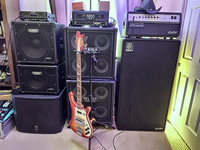 Mike's rig — Mesa/Boogie and Ampeg Heritage stacks with a Rickenbacker bass