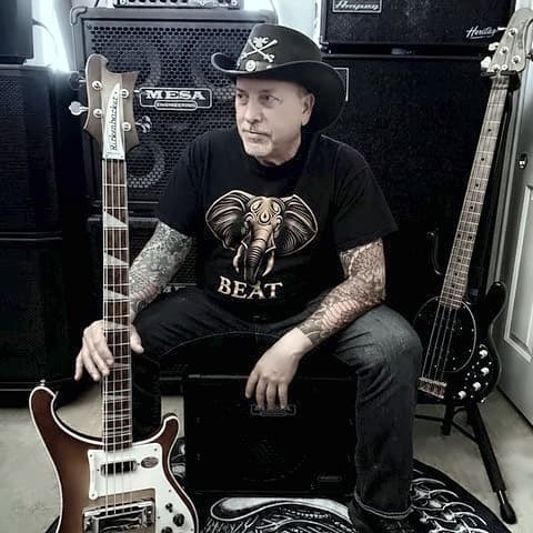 Portrait of Mike Gall with his Rickenbacker basses